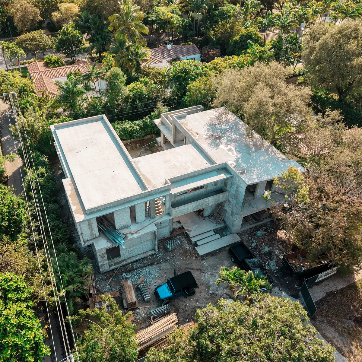 Aerial photo of Kaēlo Residence in Miami Shores: two-story concrete shell under construction by Ballagas Construction